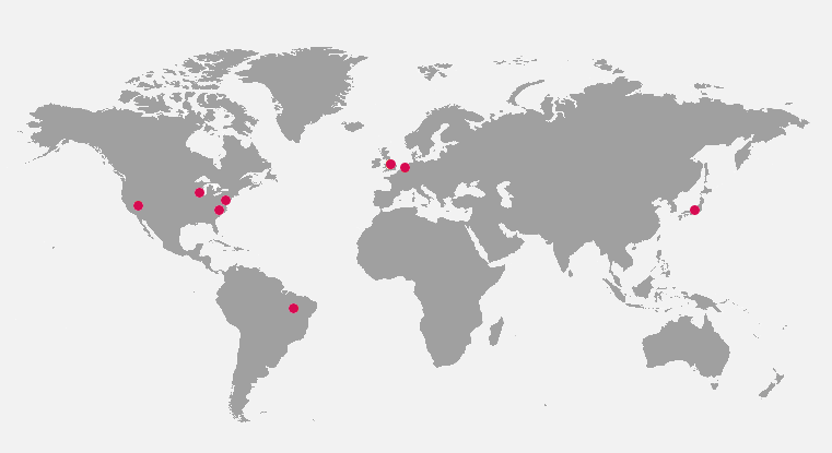 Grey map of the world showing AAAtraq locations across the world including in North America, South America, Europe and Asia.